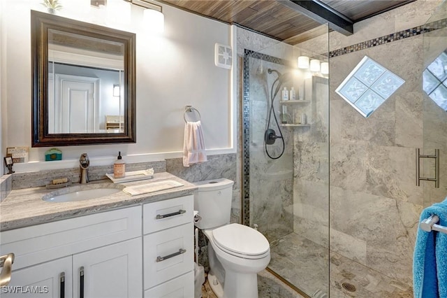 full bathroom with toilet, vanity, tile walls, and a stall shower