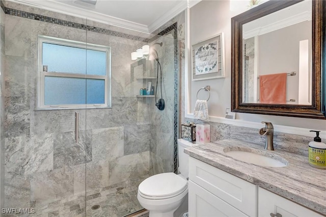 full bathroom with toilet, crown molding, vanity, and a stall shower
