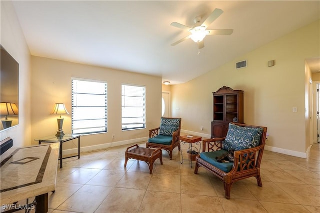 sitting room featuring lofted ceiling, ceiling fan, and light tile patterned flooring