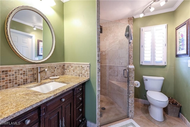 bathroom with tasteful backsplash, crown molding, an enclosed shower, and toilet