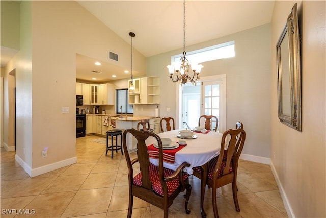 tiled dining area featuring an inviting chandelier, sink, and high vaulted ceiling