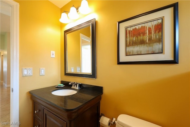 bathroom with vanity and toilet