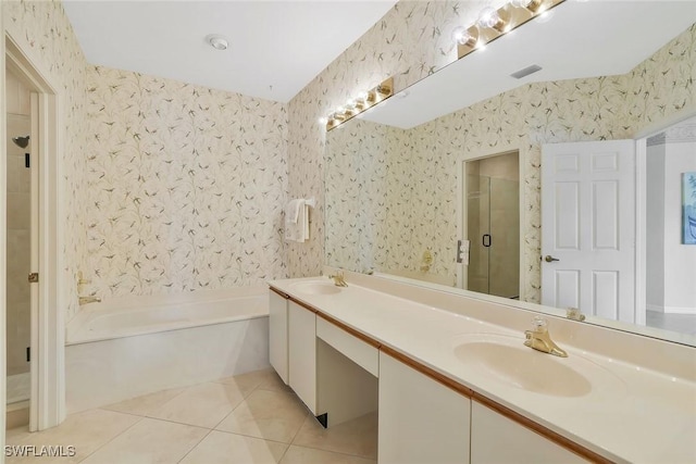 bathroom with tile patterned flooring, a sink, and wallpapered walls