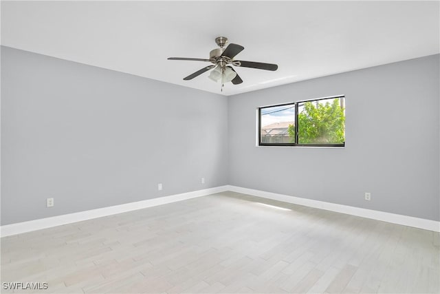 spare room featuring ceiling fan and light wood-type flooring