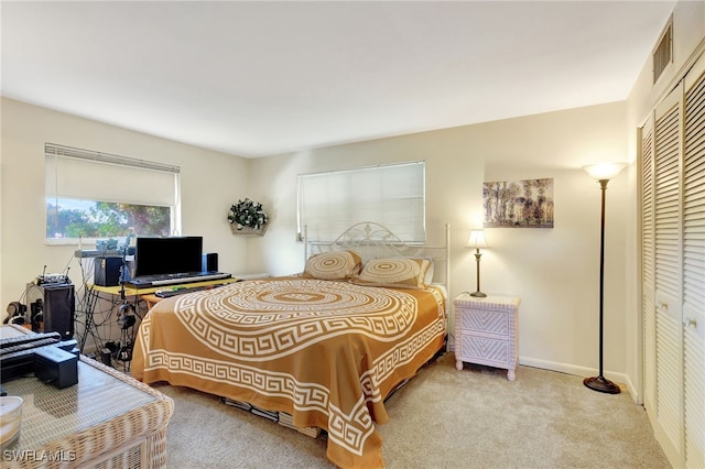 bedroom featuring a closet and carpet flooring