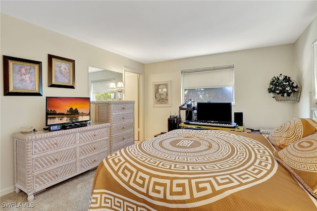 bedroom with a chandelier and carpet flooring