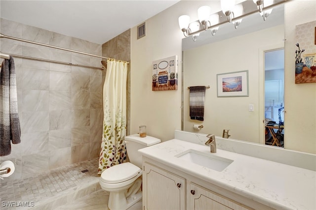 bathroom featuring vanity, toilet, and walk in shower