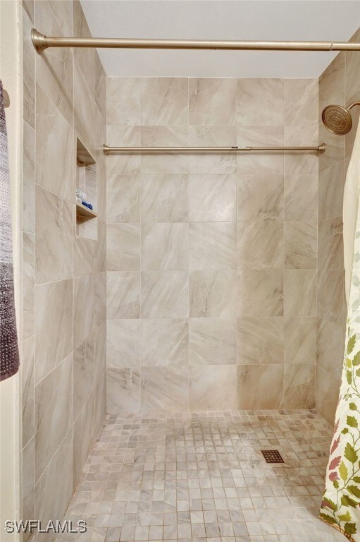 bathroom featuring a shower with curtain