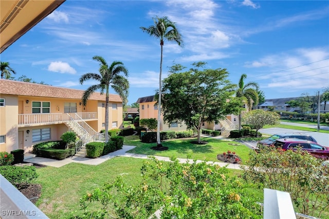 view of home's community featuring a yard