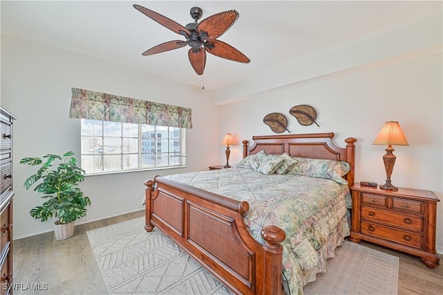 bedroom featuring light hardwood / wood-style flooring and ceiling fan