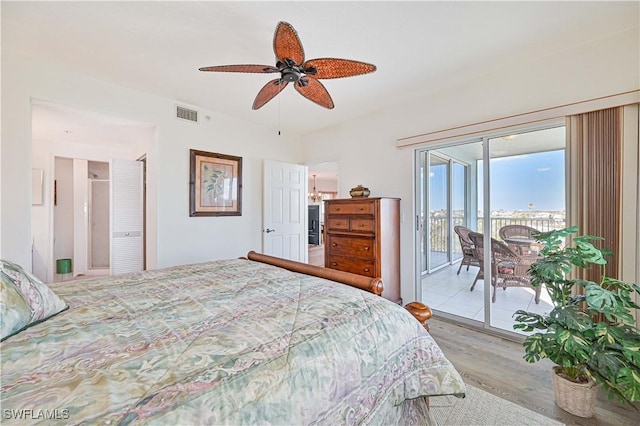 bedroom with ceiling fan, light wood-type flooring, and access to outside