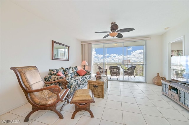 living room featuring ceiling fan and light tile patterned flooring