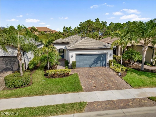 view of front of property with a garage and a front yard