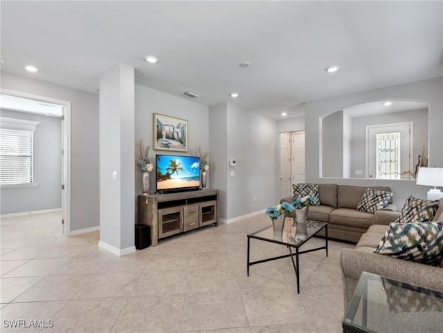 living room with light tile patterned flooring