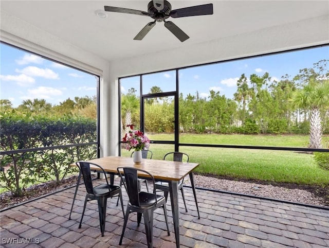 sunroom / solarium with ceiling fan