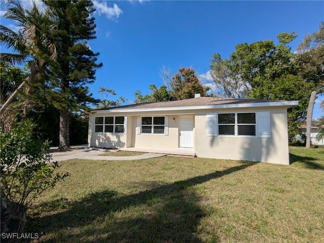 back of house with a yard