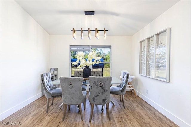 dining space featuring light wood-type flooring