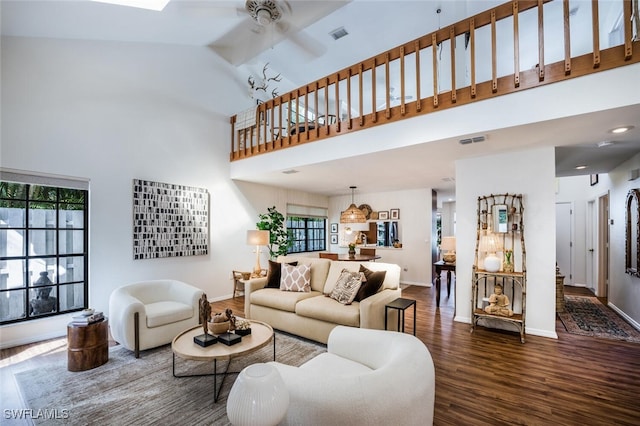 780 Meadowland Dr Unit H, Naples, FL 34108 - living room featuring visible vents, wood finished floors, baseboards, a high ceiling, and a ceiling fan