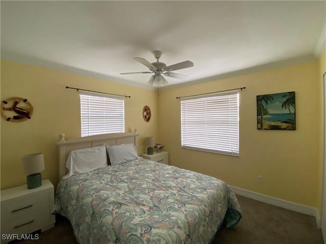 bedroom featuring carpet, baseboards, and a ceiling fan