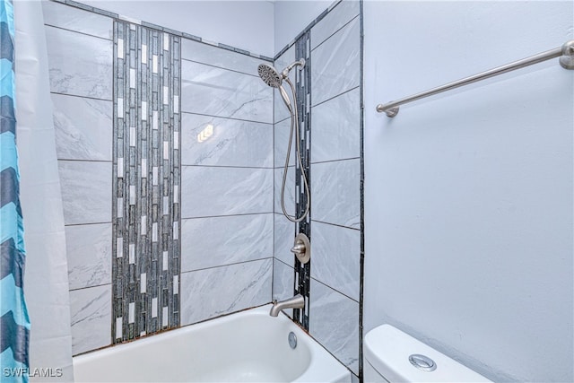 bathroom with shower / bath combination with curtain and toilet