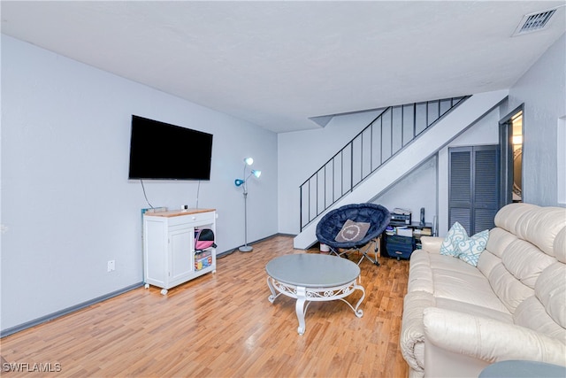 living room with light hardwood / wood-style floors