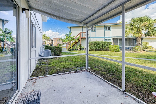 unfurnished sunroom featuring vaulted ceiling