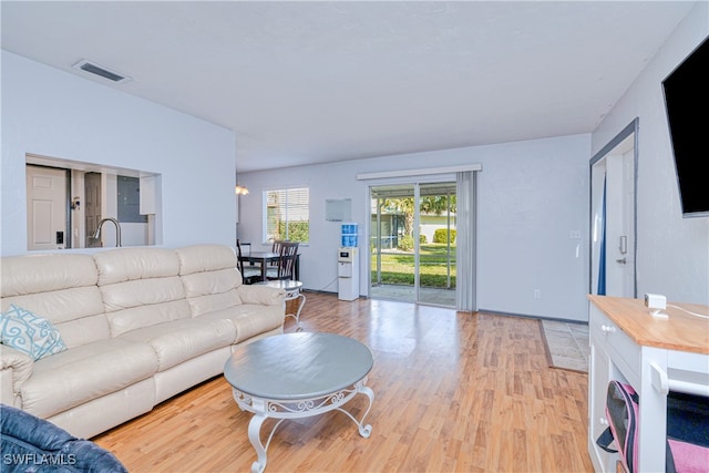 living room with light hardwood / wood-style flooring