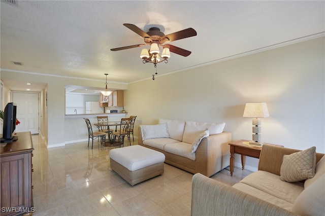 living room with ceiling fan and ornamental molding