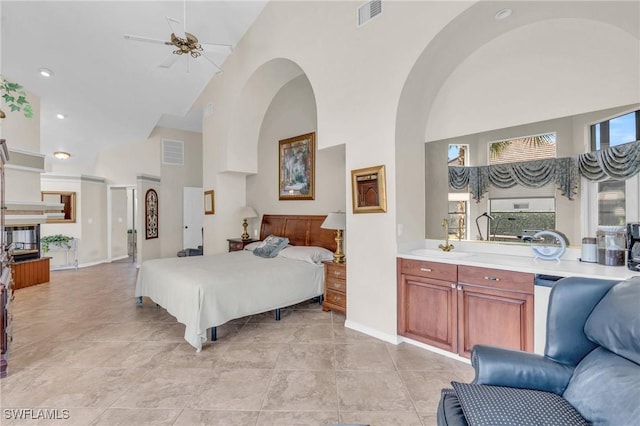 bedroom with sink and high vaulted ceiling