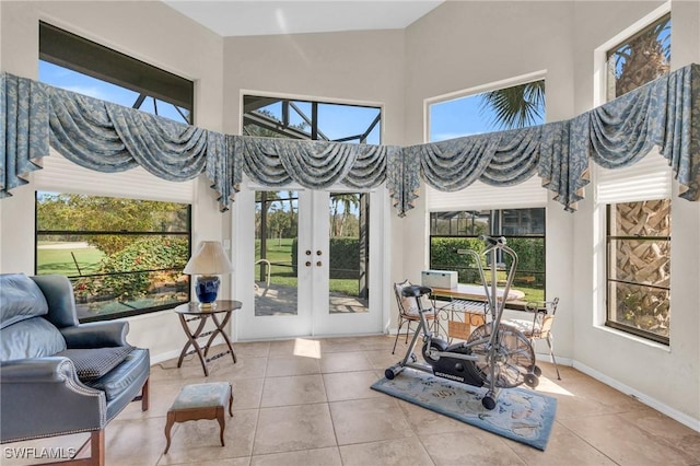 sunroom / solarium featuring french doors