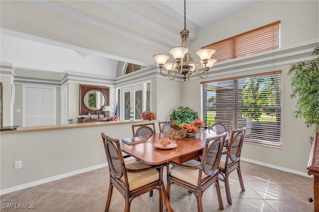 tiled dining area with a notable chandelier and crown molding