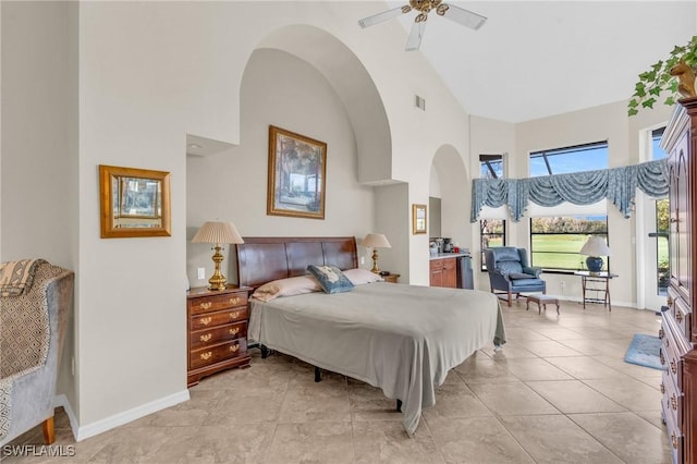 bedroom featuring ceiling fan, access to outside, high vaulted ceiling, and light tile patterned floors