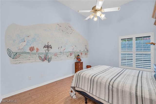 bedroom featuring hardwood / wood-style flooring and ceiling fan