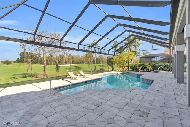 view of pool with a yard, a lanai, and a patio area