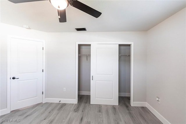 unfurnished bedroom featuring a closet, ceiling fan, and light wood-type flooring