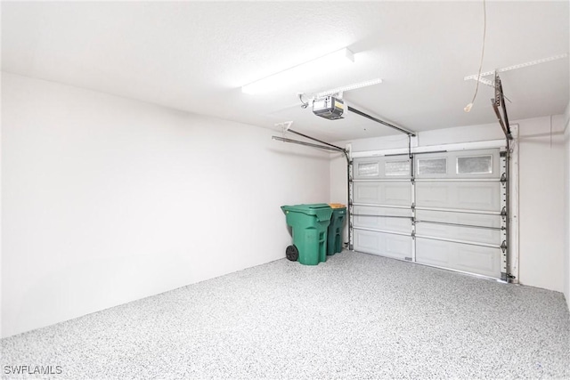 garage featuring a garage door opener