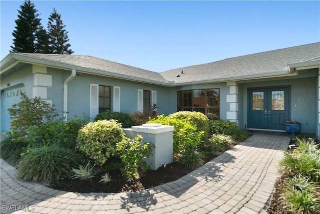 entrance to property featuring french doors