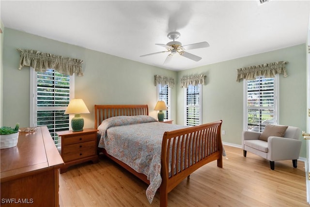 bedroom featuring ceiling fan and light wood-type flooring