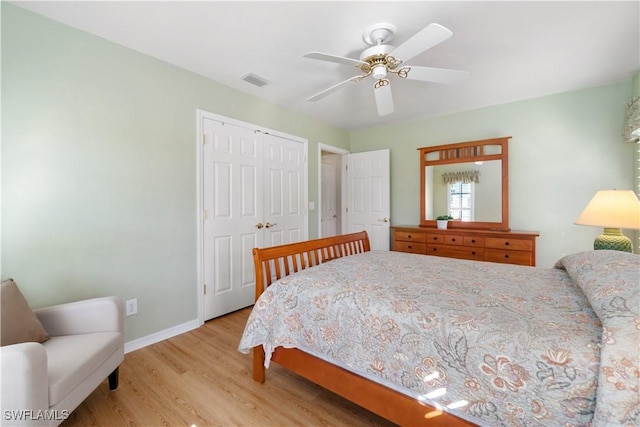 bedroom featuring light hardwood / wood-style flooring, a closet, and ceiling fan