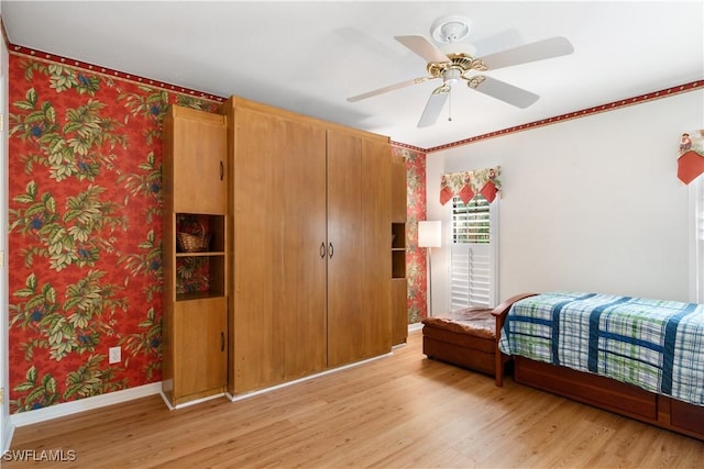 bedroom with ceiling fan and light hardwood / wood-style flooring