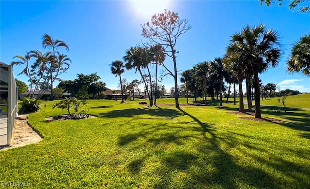 view of property's community featuring a yard