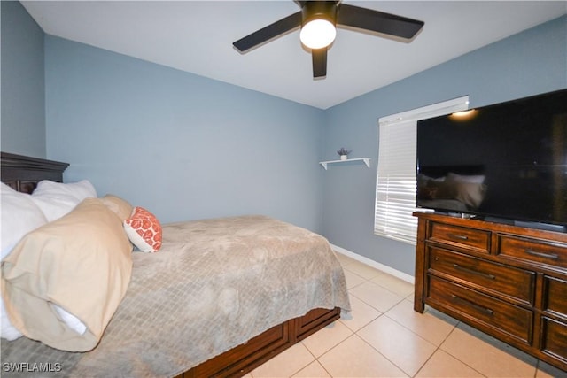 bedroom with ceiling fan and light tile patterned floors