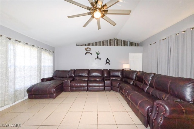 living room with lofted ceiling, light tile patterned floors, and ceiling fan