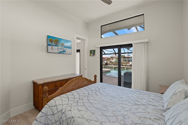 bedroom with ceiling fan, light hardwood / wood-style floors, and access to outside