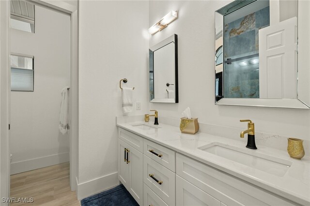 bathroom featuring vanity and hardwood / wood-style flooring