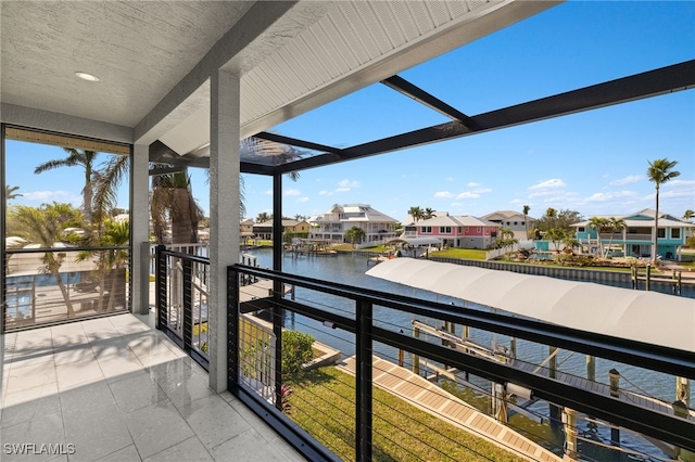 balcony featuring a water view