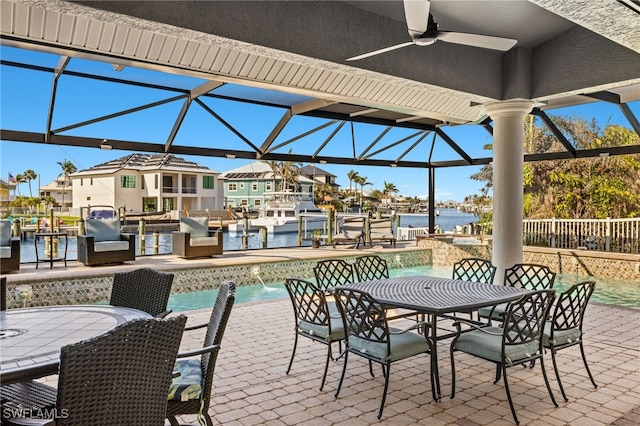 view of patio featuring pool water feature, a water view, and ceiling fan