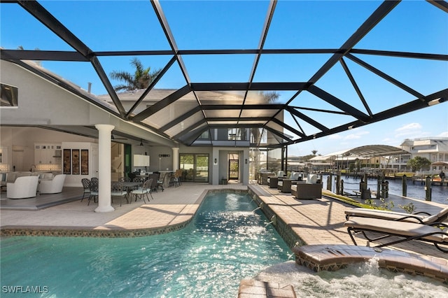 view of swimming pool featuring a water view, a patio area, pool water feature, and a lanai