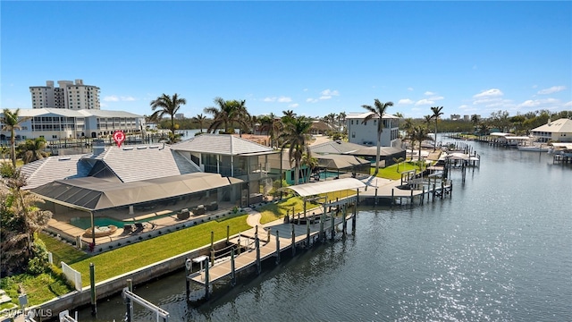 dock area featuring a water view and glass enclosure