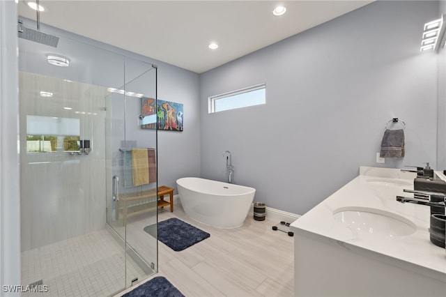 bathroom featuring vanity and separate shower and tub